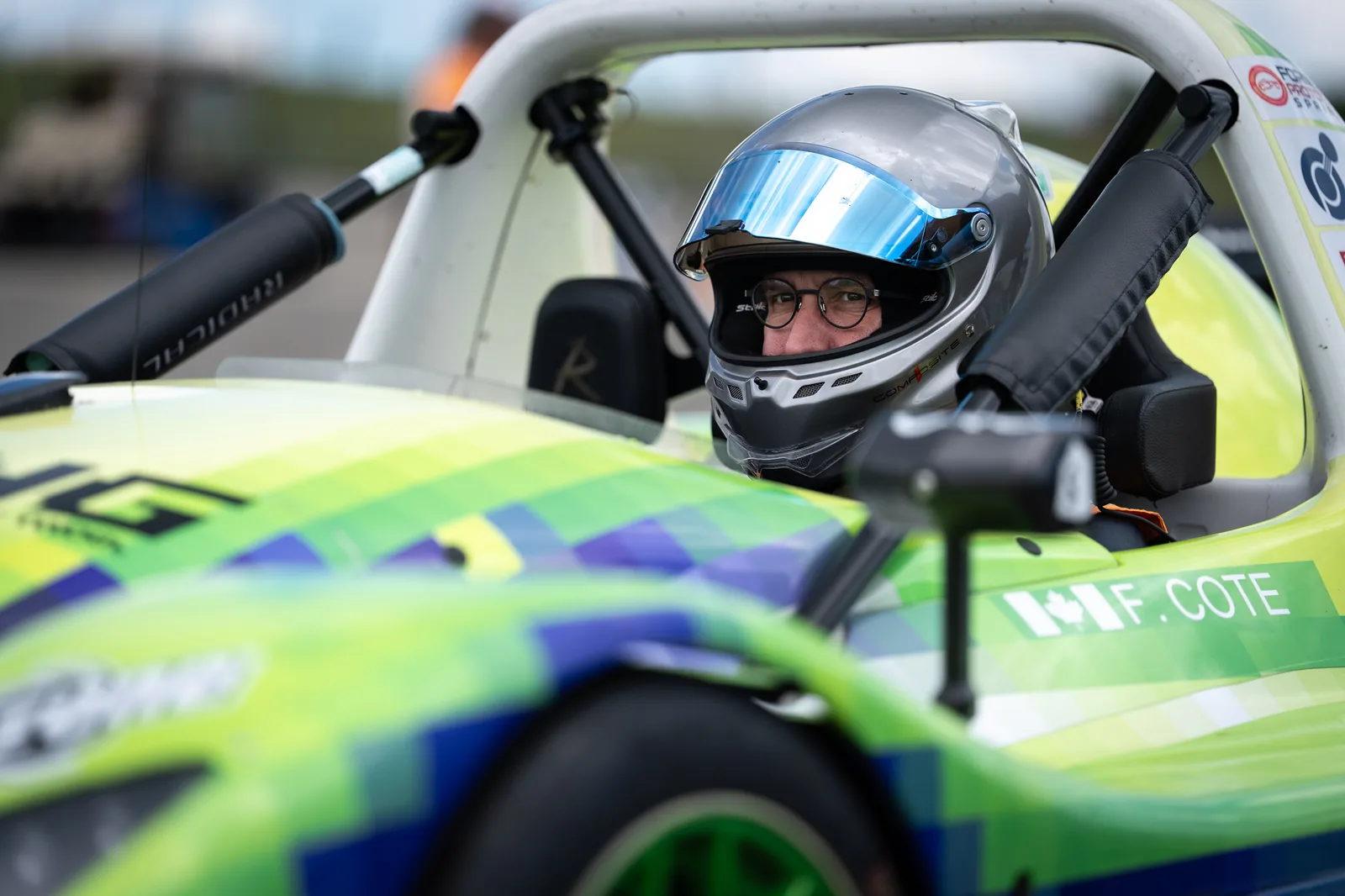 Francois Cote in the cockpit of the Radical SR3 with his name on the bodywork